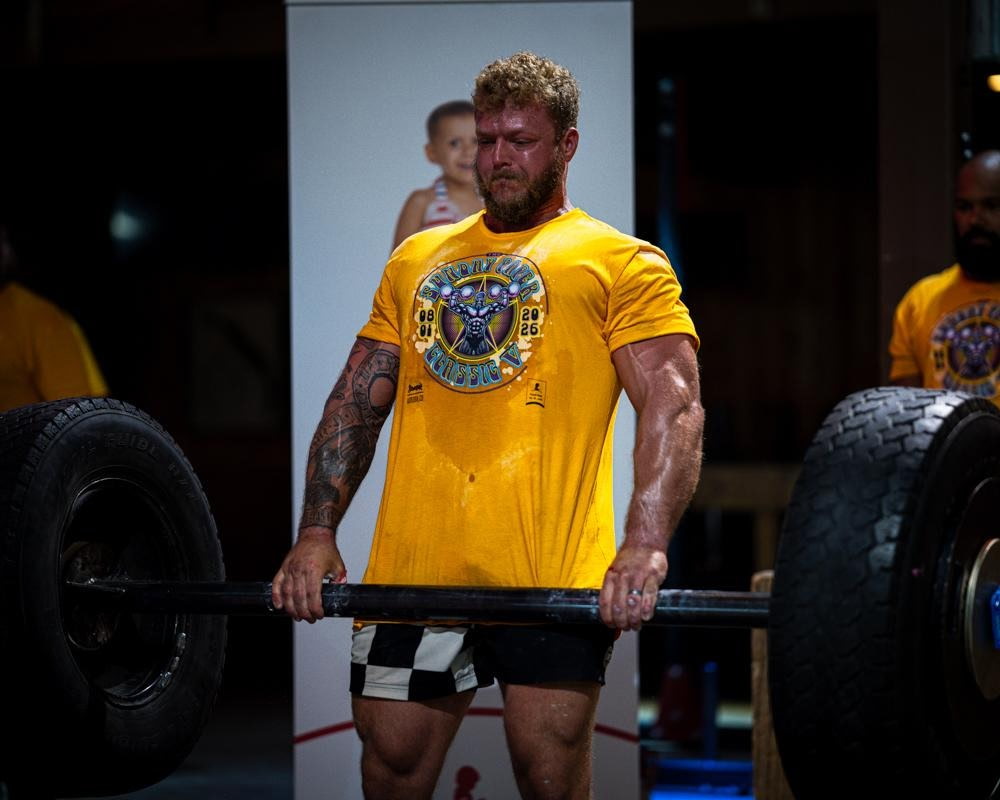 Iron Warrior athlete performing a heavy deadlift
