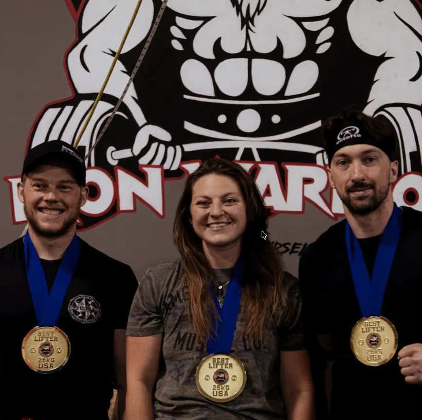 Iron Warrior athletes with powerlifting medals