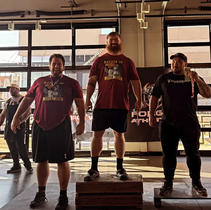 Strongman athletes on the Battle in Mile High podium