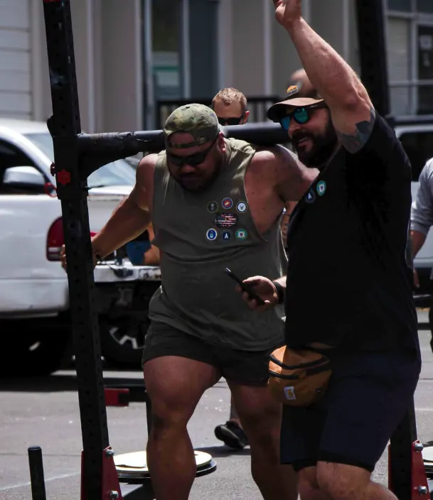 Athlete and teammate during a yoke walk