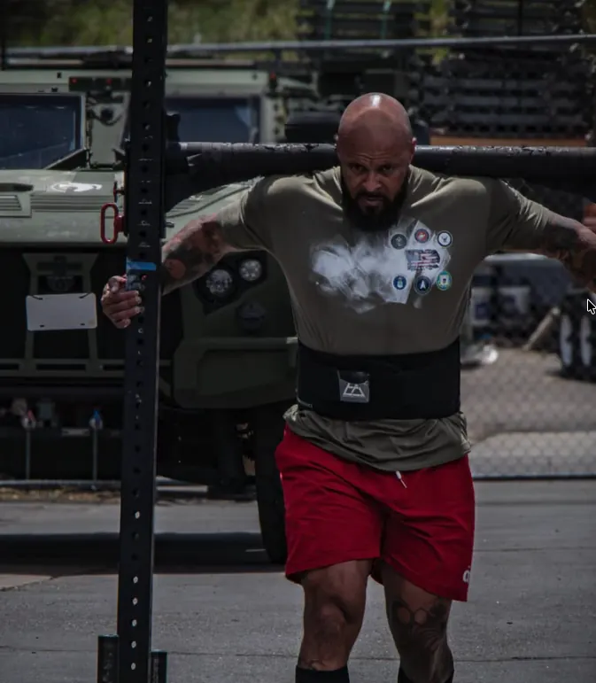 Athlete training a heavy yoke walk